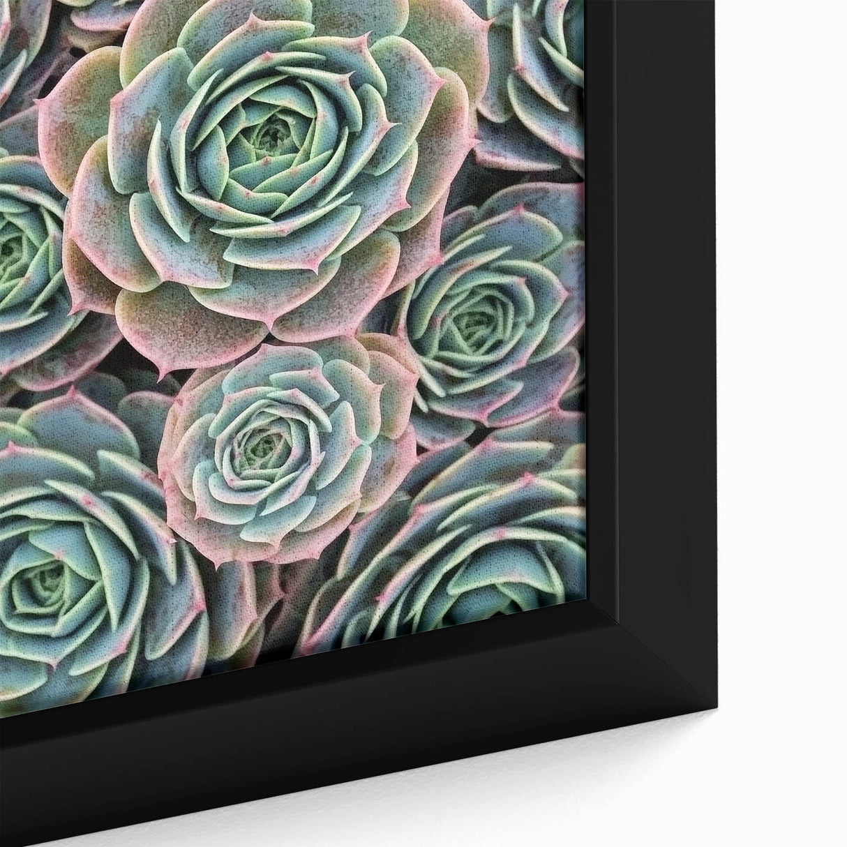 Close-up of a black framed canvas featuring vibrant floral designs in textured style, ideal for living room decor.