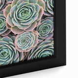 Close-up of a black framed canvas featuring vibrant floral designs in textured style, ideal for living room decor.