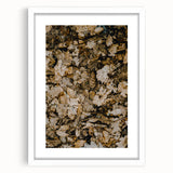 Abstract art print featuring fall-inspired colors in a white frame, ideal for dining room or bedroom decor.