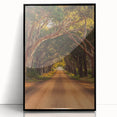 Framed acrylic print showcasing a serene countryside landscape with vibrant green fields and a blue sky, highlighted by a sleek black frame, perfect for home décor.
