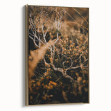 Framed canvas featuring a vintage poster-style landscape with autumnal trees in gold and black tones.