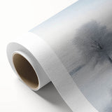Winter scene with soft blue and white hues on rolled canvas, suitable as nursery wall art.