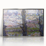 Large art print of Van Gogh's Starry Night in a silver frame, showcasing bold blue and yellow swirls.