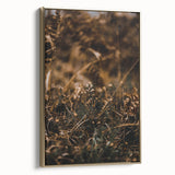 Framed canvas featuring a vintage landscape painting of autumn trees in gold and black tones, ideal for bedroom decor.