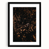 Extra large abstract art print featuring textured fall foliage in vibrant reds and oranges, framed in black.