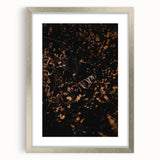 Textured abstract art print in autumnal shades on a silver-framed canvas, ideal for bedroom decor.
