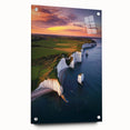 Side view of a vibrant acrylic landscape artwork depicting dramatic cliffs, featuring a glossy finish and secured with decorative pins for display. Perfect for enhancing modern interiors.