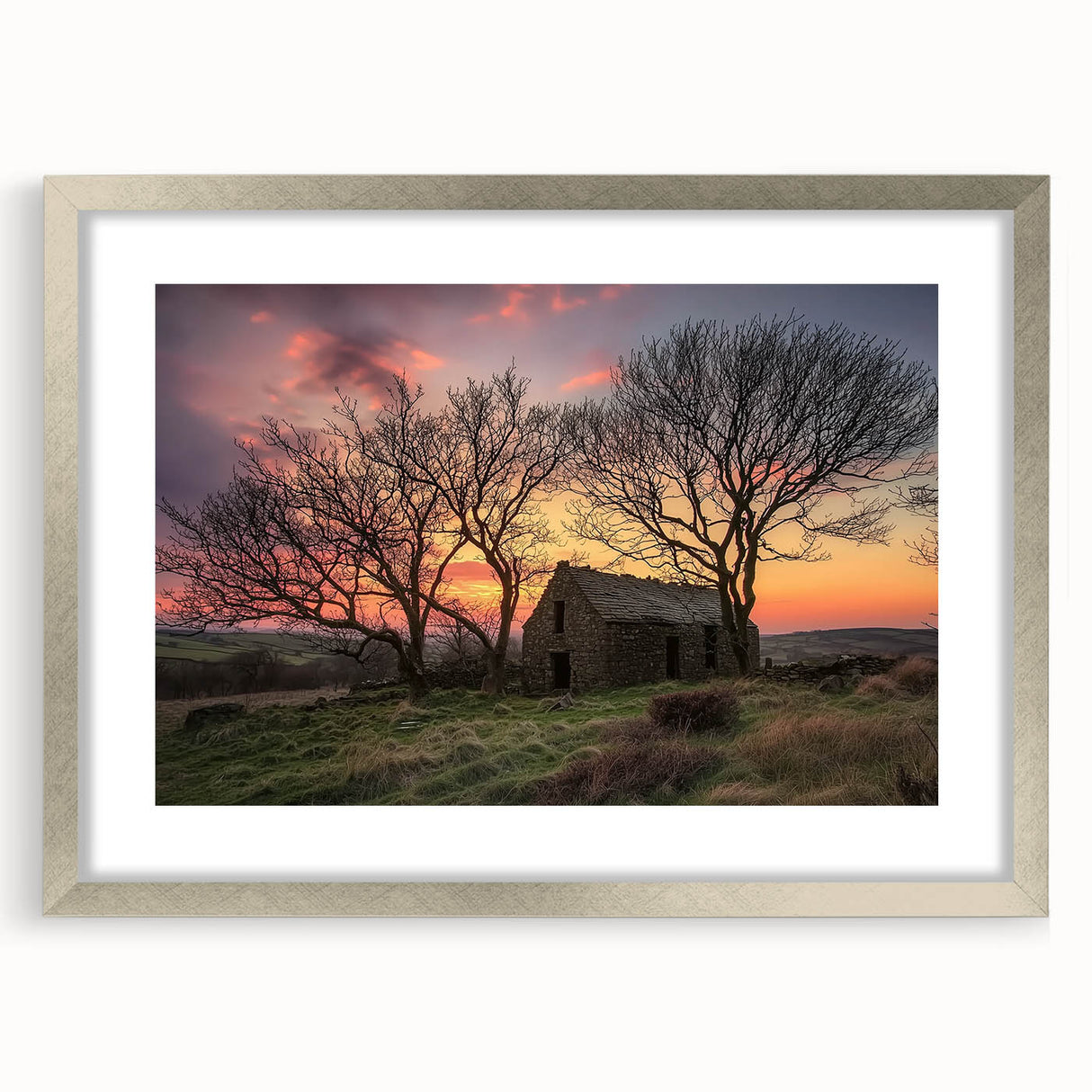 Framed landscape barn artwork in a silver mat, showcasing a rustic scene with warm colors, ideal for enhancing home decor, available from a premium art retailer.