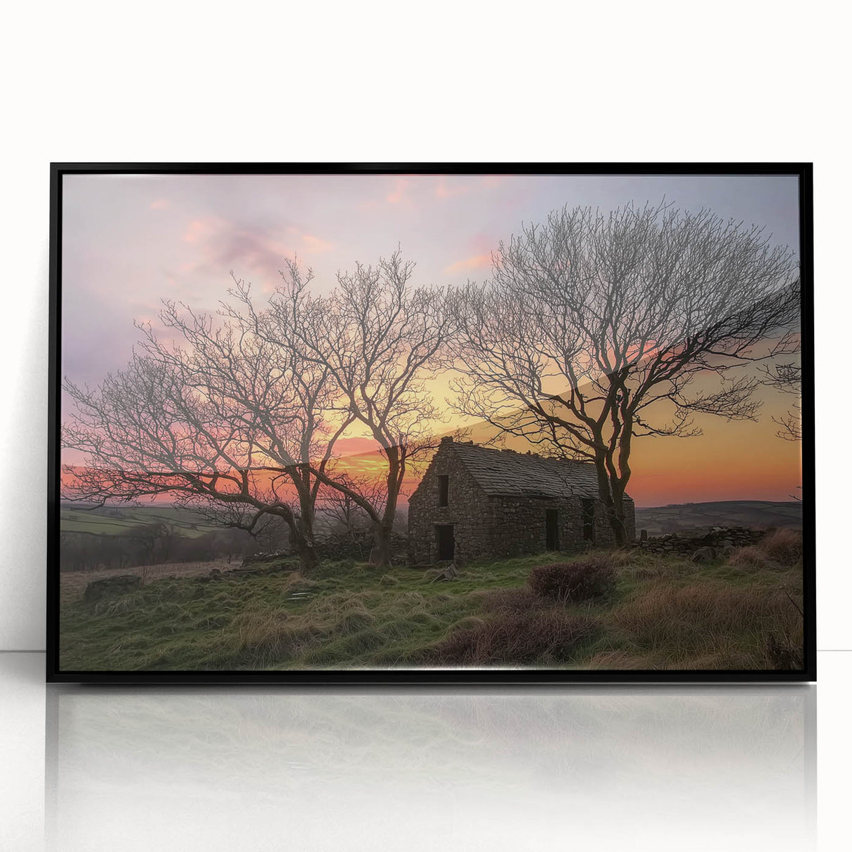Framed landscape artwork of a serene barn scene, featuring vibrant colors and detailed brushwork, showcasing a black frame for a modern touch.