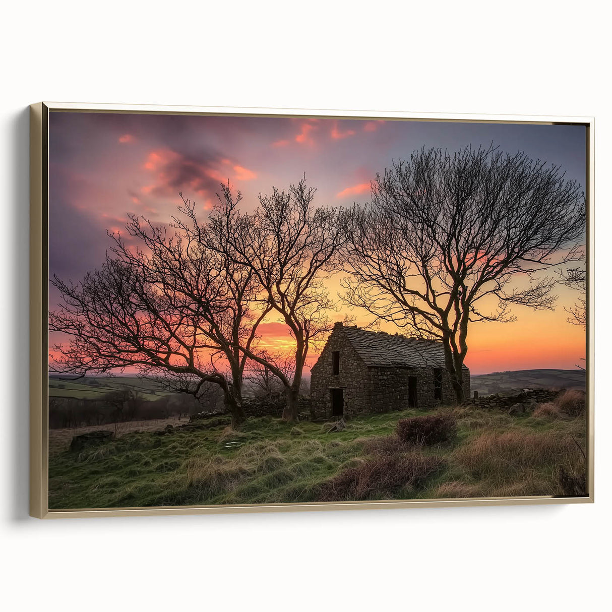 Barn landscape canvas print framed in gold, showcasing a serene rural scene with vibrant colors, ideal for home decor or art collectors. The artwork is elegantly displayed from a side view, highlighting its framing details and texture.
