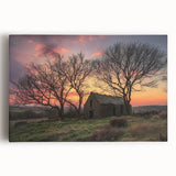 Stretched canvas artwork depicting a serene landscape scene with a rustic barn, showcasing vibrant greenery and a clear blue sky, perfect for home decor.