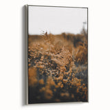 Framed canvas landscape art depicting fall foliage in muted earth tones.