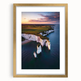 Framed landscape artwork showcasing majestic cliffs in vibrant colors, elegantly matted with a gold border, perfect for home decor and interior design enhancement.