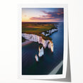 Vibrant landscape print showcasing rugged cliffs and serene skies, rolled and ready for display, highlighting natural beauty and artistic detail in a protective tube.