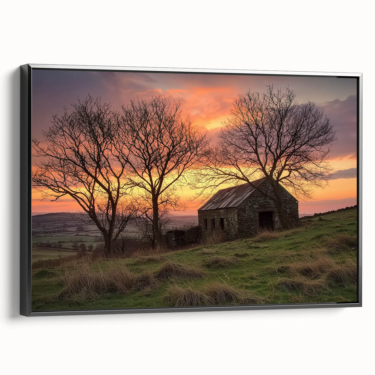 Landscape barn-framed canvas artwork showcasing a rustic black design, viewed from the side, perfect for enhancing home decor with a touch of elegance.