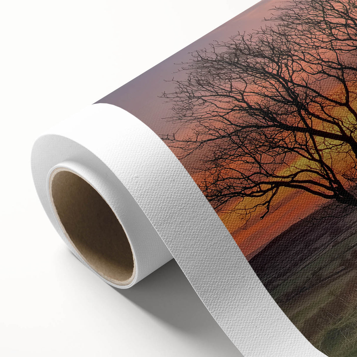 Rolled canvas depicting a serene landscape with a rustic barn, showcasing vibrant colors and intricate details, securely packaged in a robust cardboard tube for safe delivery.