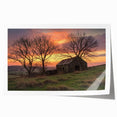 Landscape barn scene print showcasing a rustic red barn surrounded by lush green fields and a bright blue sky, rolled and ready for display in a cardboard tube.