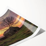 Rolled landscape barn print showcasing a serene rural setting with vibrant colors, packaged securely in a durable cardboard tube for easy transport and display.