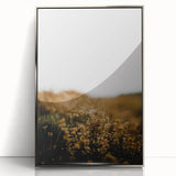 Mid-century modernist art depicting an abstract fall scene in orange and brown tones, acrylic print in a silver frame.