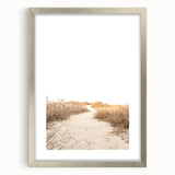 Textured abstract art print depicting summer season in vibrant orange and yellow hues, framed in silver.