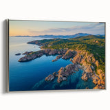 Framed canvas artwork depicting a serene landscape with cliffs, featuring a silver side view, perfect for home decor and interior design enhancement.