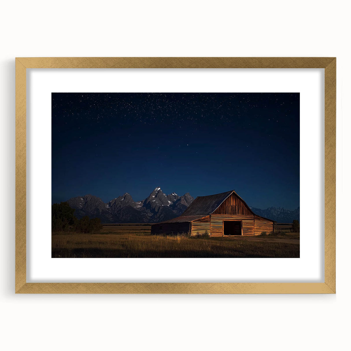 Framed landscape artwork of a rustic barn with a gold mat, showcasing a picturesque rural scene, ideal for home decor or art enthusiasts.