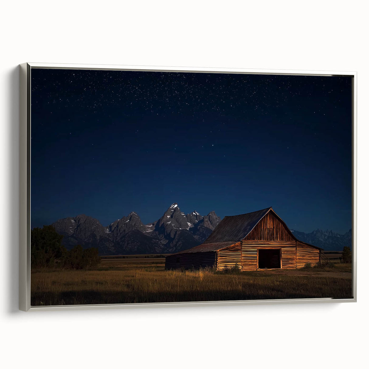 Landscape canvas art showcasing a serene barn scene, framed in silver, highlighting intricate details and textures. Ideal for enhancing home decor with rustic charm.