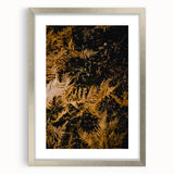 Textured abstract art print in warm autumn hues on a silver-framed canvas, suitable for bedroom decor.
