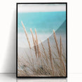 Large abstract wall art in vibrant orange and yellow tones on a black acrylic frame, ideal for modern living room decor.