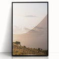 Large abstract wall art featuring swirling blue and gray patterns on a black acrylic frame.
