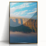 Framed acrylic landscape artwork showcasing dramatic cliffs with a gold border, perfect for adding a touch of elegance to modern home decor.