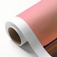 Rolled canvas artwork depicting a serene countryside landscape with lush greenery and a clear blue sky, elegantly packaged in a protective cardboard tube for delivery.