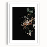 Abstract art print featuring warm autumnal hues on a white framed canvas, suitable for bedroom or dining room decor.