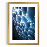 Framed artwork showcasing a scenic landscape with caves, featuring a gold mat border and elegant design, perfect for home decor or artistic display.