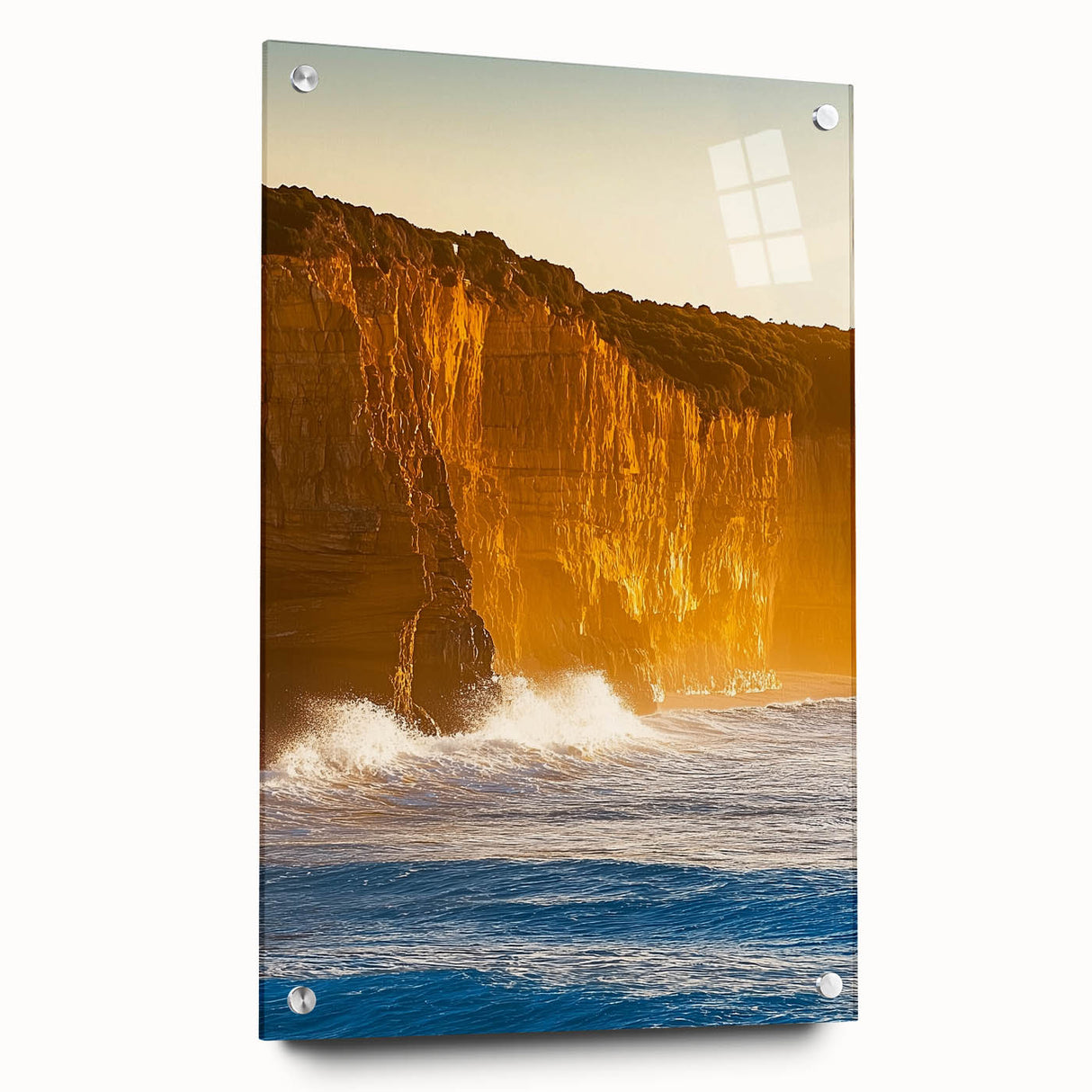 Abstract acrylic landscape artwork depicting cliffs and ocean waves, presented in a glass frame with pins for mounting. Ideal for modern home decor.