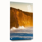 Abstract acrylic landscape artwork depicting cliffs and ocean waves, presented in a glass frame with pins for mounting. Ideal for modern home decor.