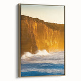 Framed canvas artwork showcasing a scenic landscape of dramatic cliffs, elegantly bordered in gold, perfect for enhancing modern home decor with a touch of nature.