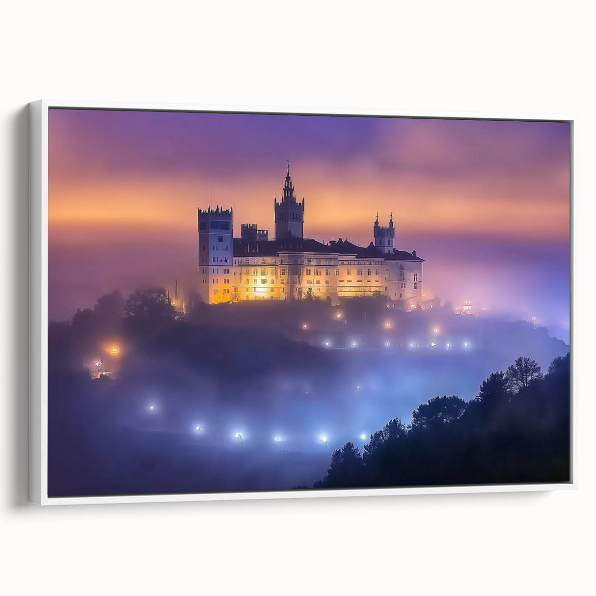 Framed canvas artwork showcasing a serene landscape with a castle, featuring a white frame and side view. Ideal for home decor, this piece adds elegance and charm to any room.