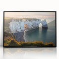 Framed acrylic artwork depicting dramatic cliffs against a vibrant sky, showcasing intricate details and bold colors, perfect for modern home decor.