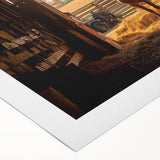 Rolled canvas showcasing a vibrant landscape design with a rustic barn, featuring rich colors and intricate details, securely packaged in a protective cardboard tube.