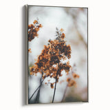 Framed canvas of a vintage landscape painting featuring autumnal trees with vibrant orange and red leaves.
