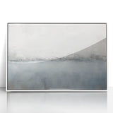 Framed acrylic wall art featuring abstract strokes in shades of blue and white, perfect for modern home decor. This piece adds a contemporary touch to any living space.