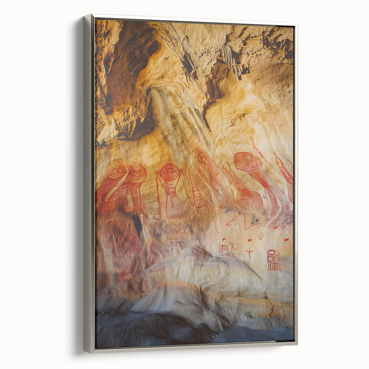 Framed canvas artwork showcasing a stunning landscape view of caves, featuring a silver frame that enhances the natural colors and textures of the scene, perfect for home decor.