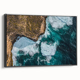 Framed canvas artwork depicting a breathtaking landscape of dramatic cliffs, showcasing vibrant colors and intricate details, with a sleek black frame enhancing its elegance.