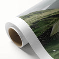 Landscape barn scene printed on rolled canvas, showcasing vibrant colors and detailed textures, housed in a protective cardboard tube for safe shipping.