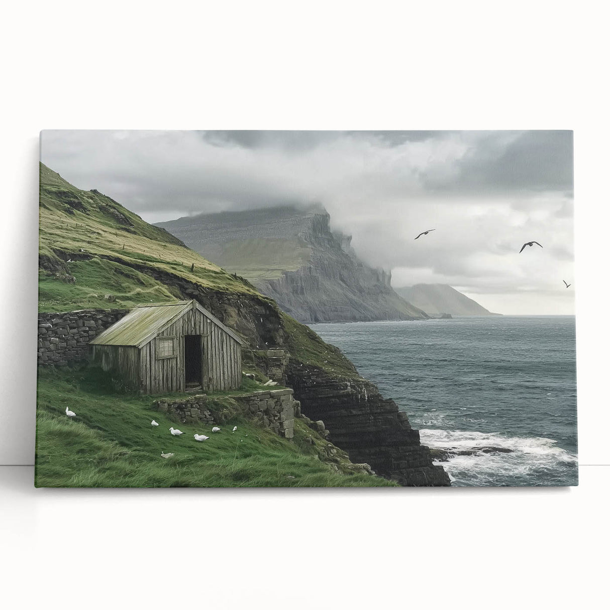 Stretched canvas art featuring a rustic landscape scene with a barn, leaning against a wall, showcasing earthy tones and serene countryside vibes, perfect for home decor.