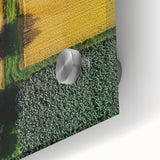 Close-up of an acrylic landscape artwork depicting a serene countryside scene with vibrant green fields, rolling hills, and a clear blue sky, perfect for home decor.