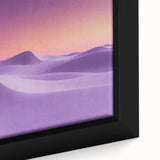 Close-up of a framed canvas artwork depicting a serene desert landscape, showcasing vibrant orange and yellow hues of the sunset over sand dunes, perfect for home decor.