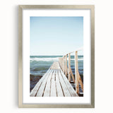 Textured abstract art print featuring swirling gray and white patterns, presented in a silver frame.