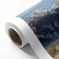 Rolled landscape canvas showcasing a rustic barn scene, featuring rich textures and earthy colors, elegantly packaged in a protective cardboard tube for safe delivery.